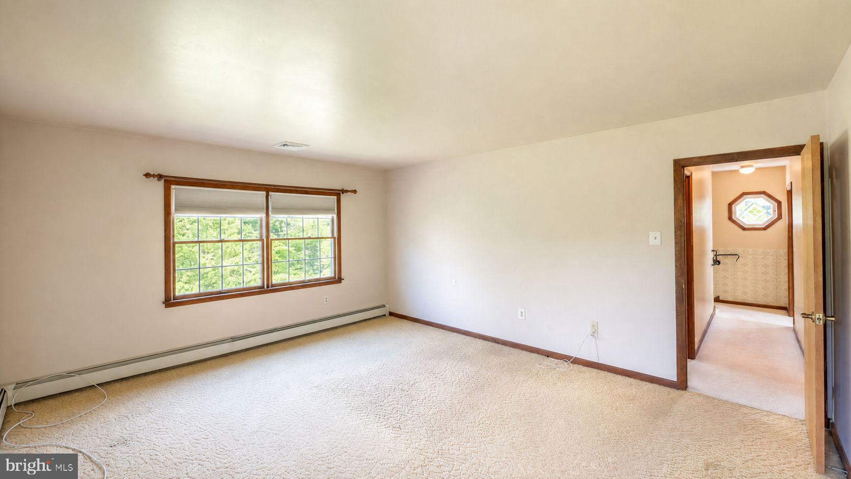 223 Trythall Road Elverson, PA 19520 - Photo 45 of 78 an empty room with windows and closet