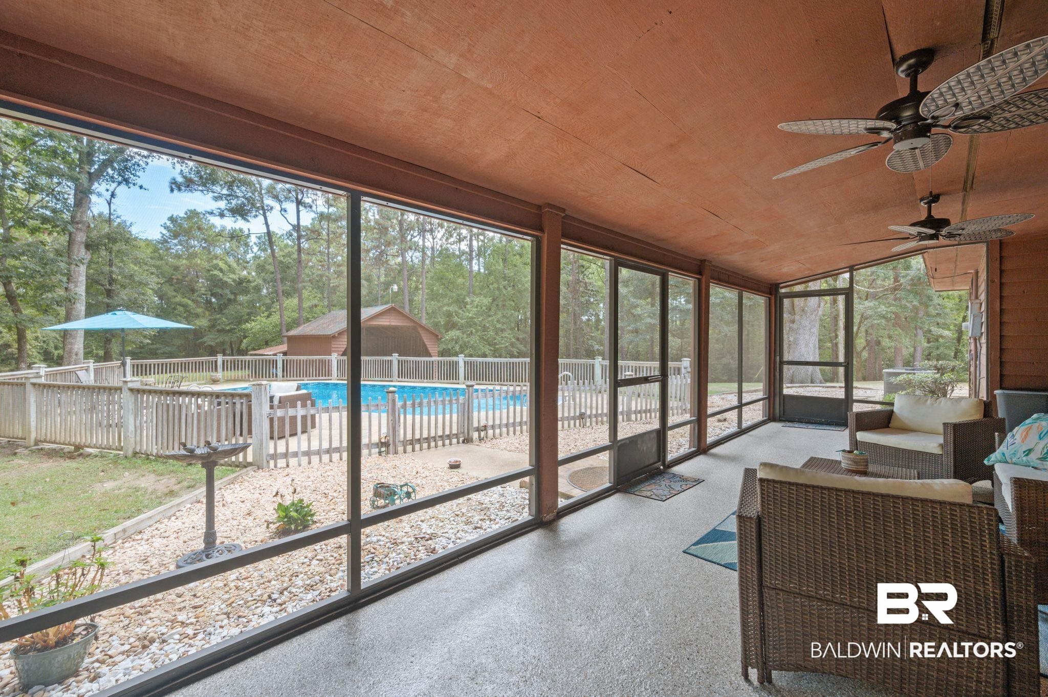 4566 McCrary Road, Unit A Semmes, AL 36575 - Photo 7 of 28 Sunroom with wooden ceiling and ceiling fan