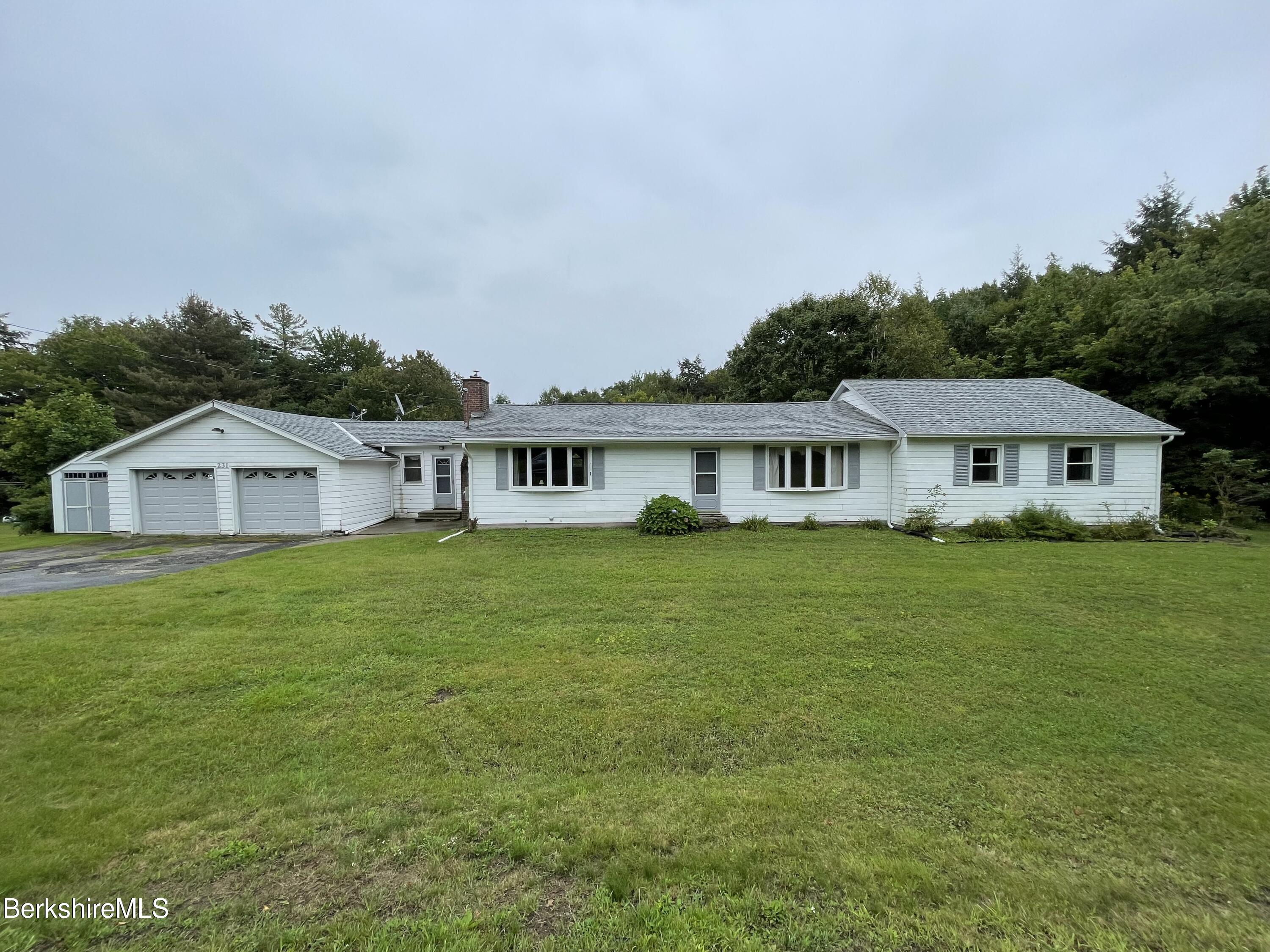 231 Central Shaft Road Florida, MA 01247 - Photo 1 of 21 a front view of house with yard and green space