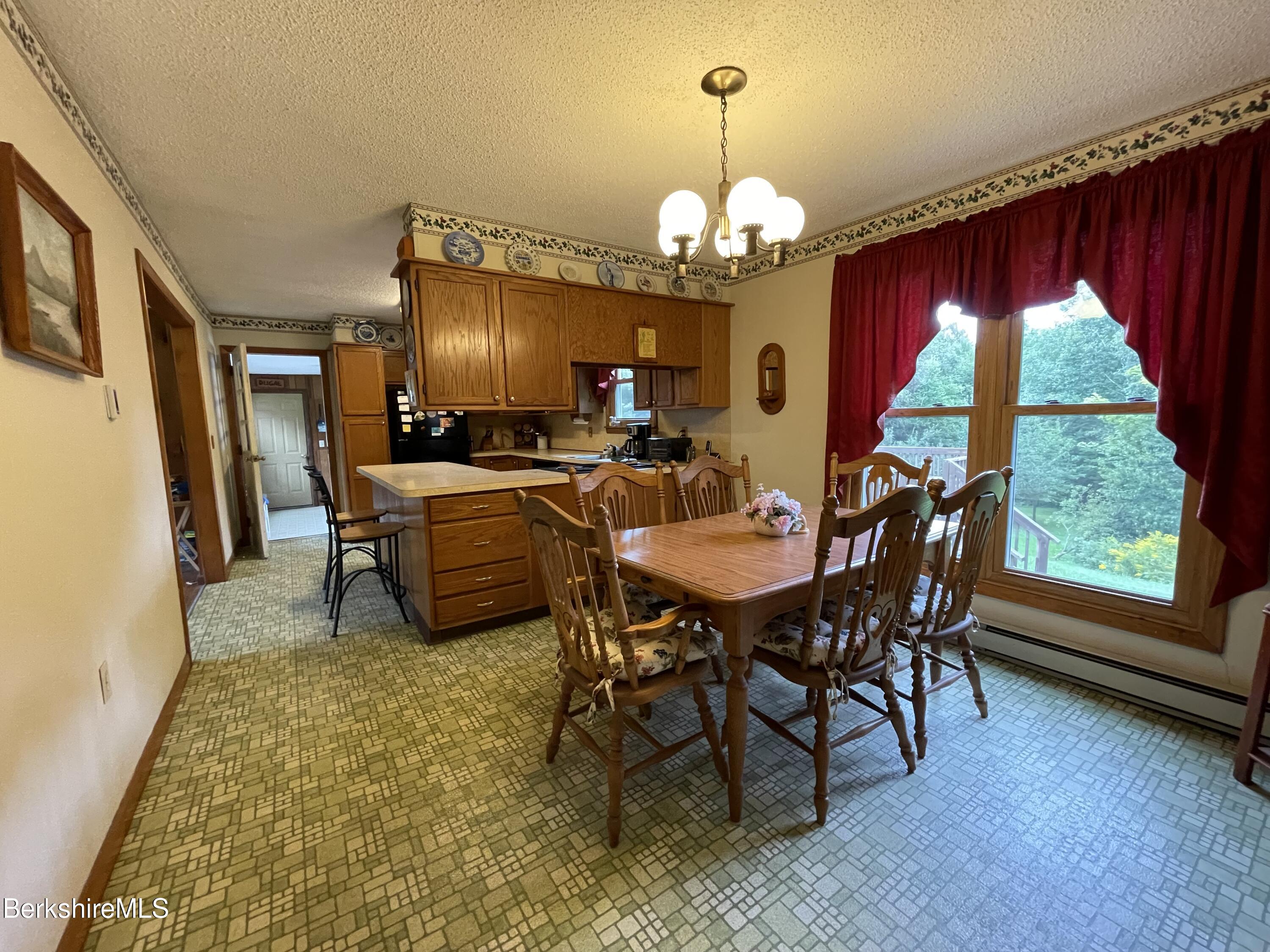 231 Central Shaft Road Florida, MA 01247 - Photo 8 of 21 a view of a dining room with furniture window and outside view