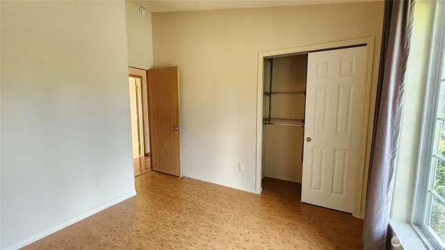 a view of a hallway with a wooden floor