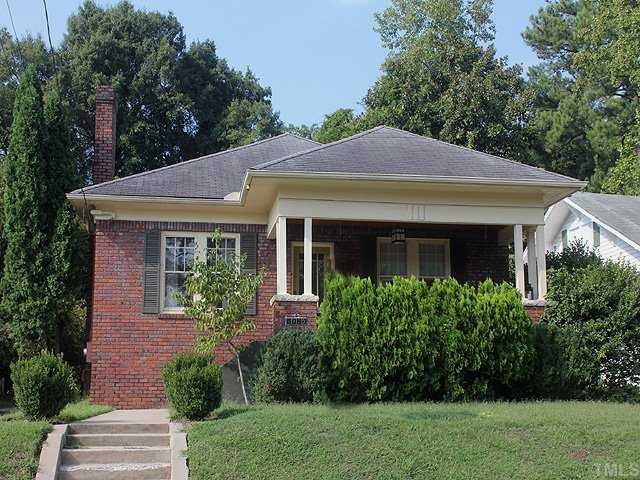 2215 Creston Road Raleigh, NC 27608 - Photo 1 of 14 a front view of a house with a yard