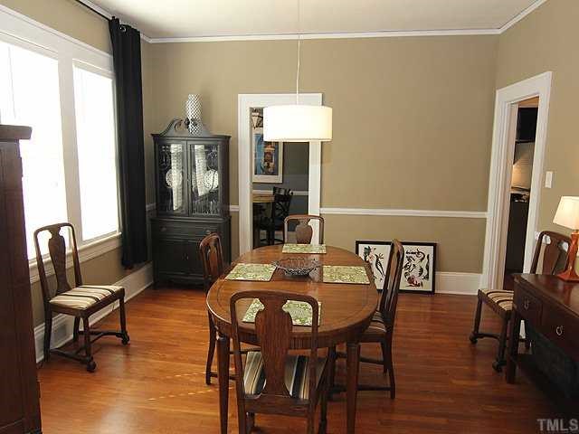 2215 Creston Road Raleigh, NC 27608 - Photo 5 of 14 a view of a dining room with furniture and wooden floor