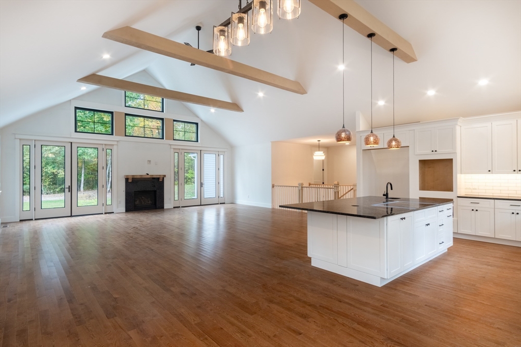 30 Red Bridge Road Wilbraham, MA 01095 - Photo 4 of 4 a kitchen with stainless steel appliances granite countertop a sink a stove and a wooden floors