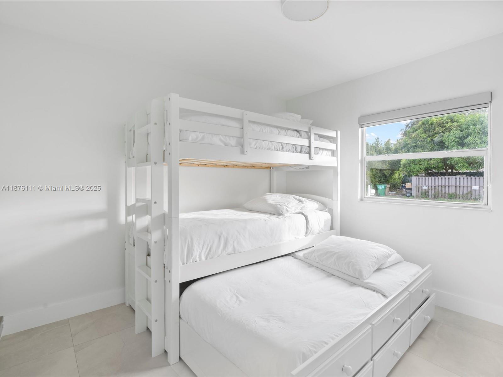 5731 Southwest 54th Terrace Davie, FL 33314 - Photo 11 of 22 a bed room with a bed and a window