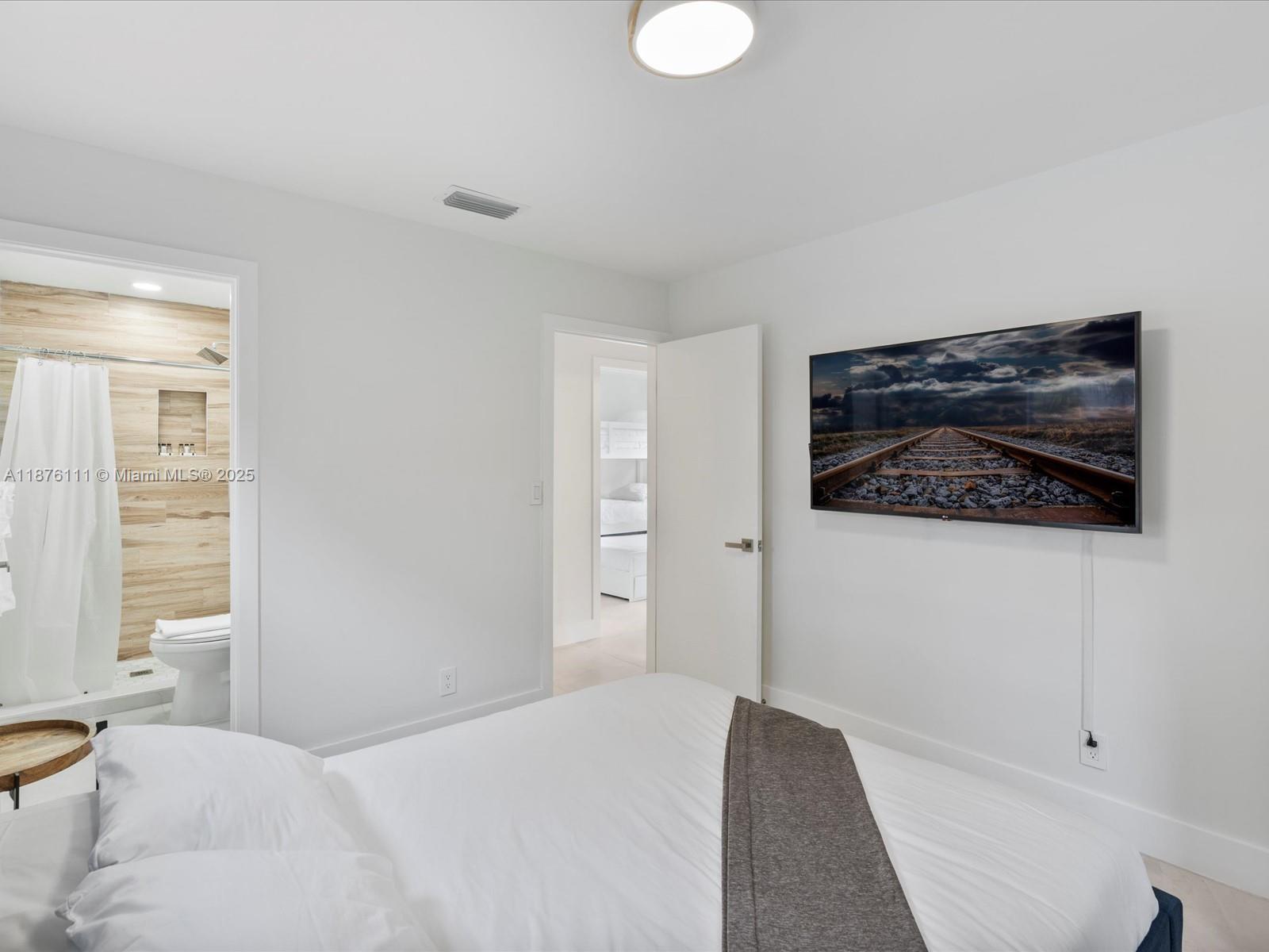 5731 Southwest 54th Terrace Davie, FL 33314 - Photo 12 of 22 a bedroom with a bed and a window