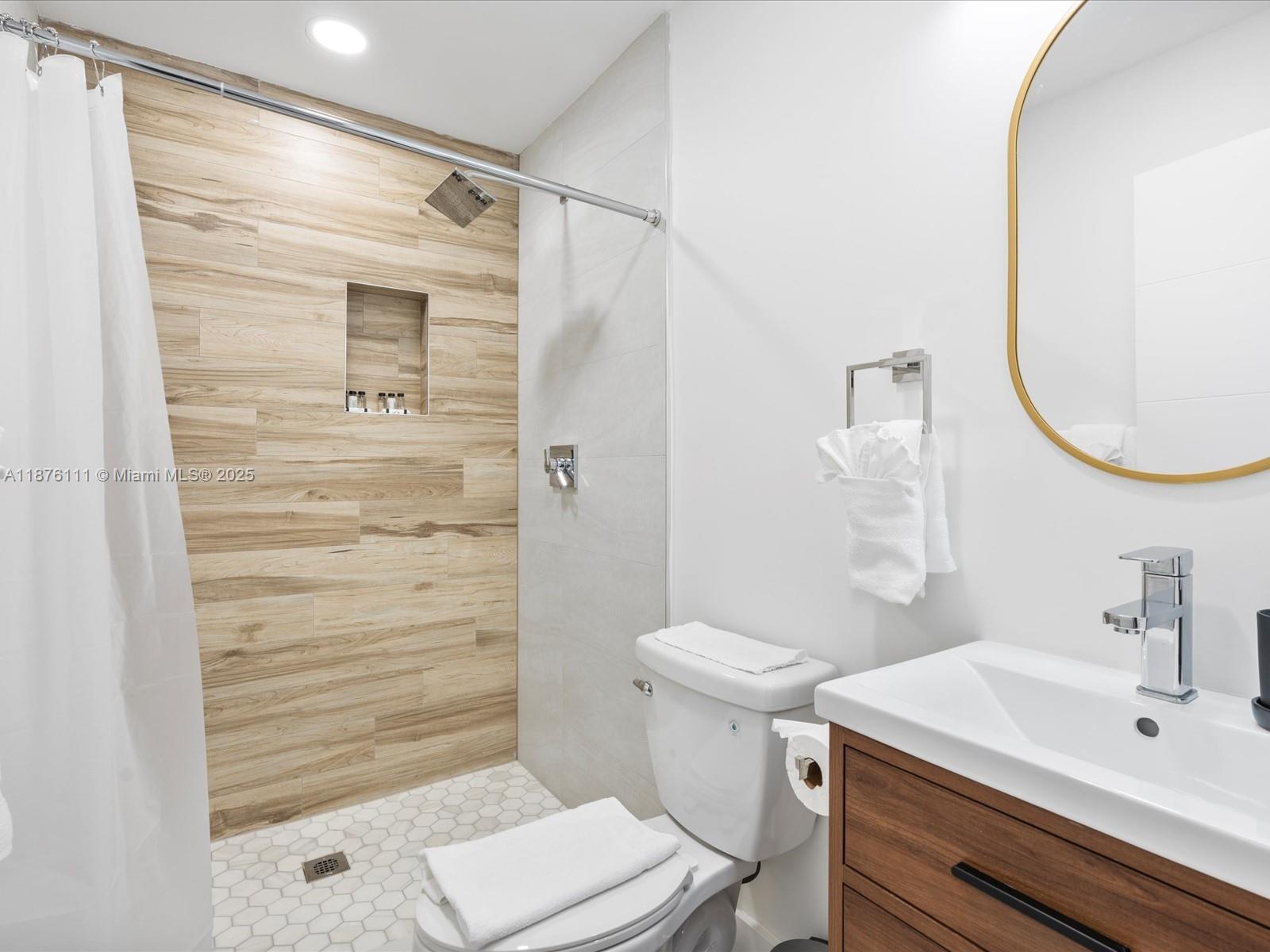 5731 Southwest 54th Terrace Davie, FL 33314 - Photo 16 of 22 a bathroom with a sink a toilet and shower