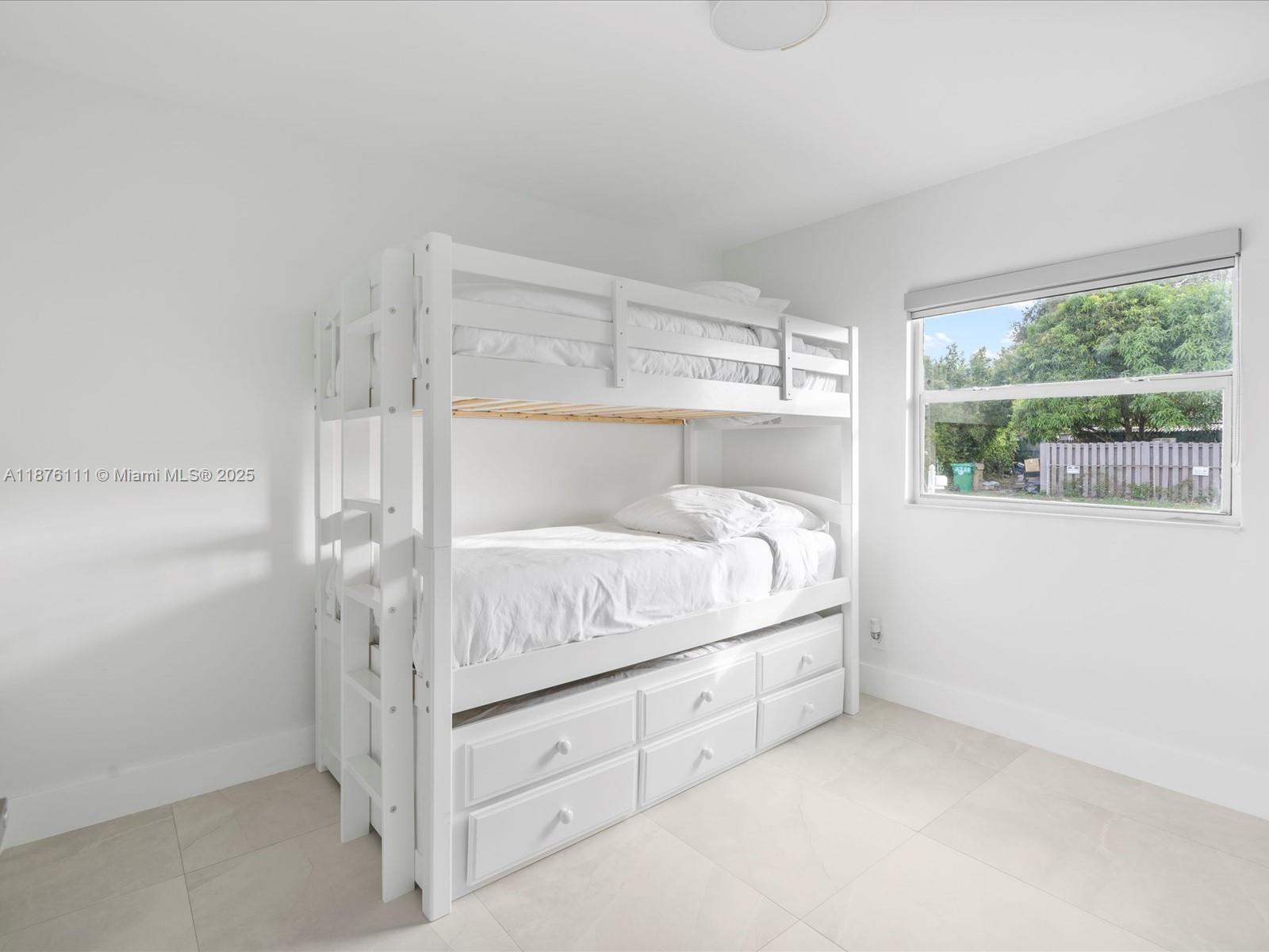 5731 Southwest 54th Terrace Davie, FL 33314 - Photo 19 of 22 a bed room with a bed and a window