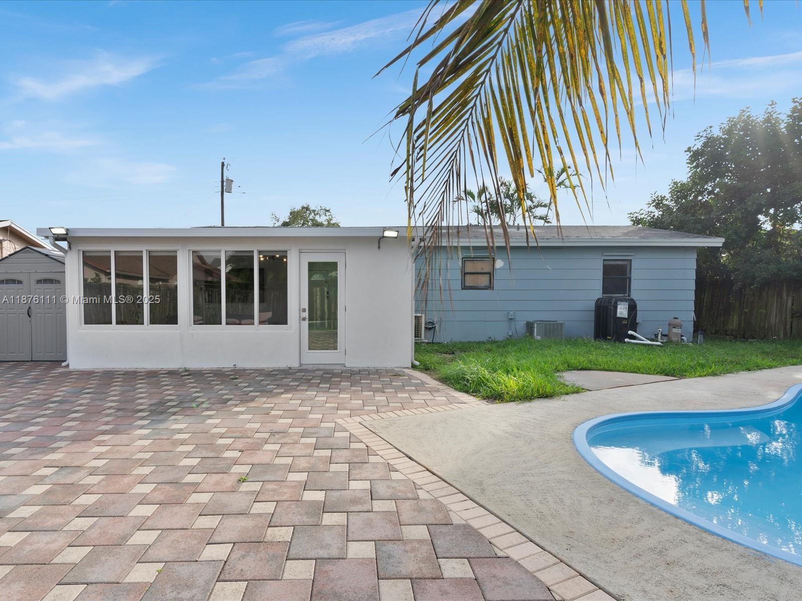 5731 Southwest 54th Terrace Davie, FL 33314 - Photo 20 of 22 a front view of a house with a yard
