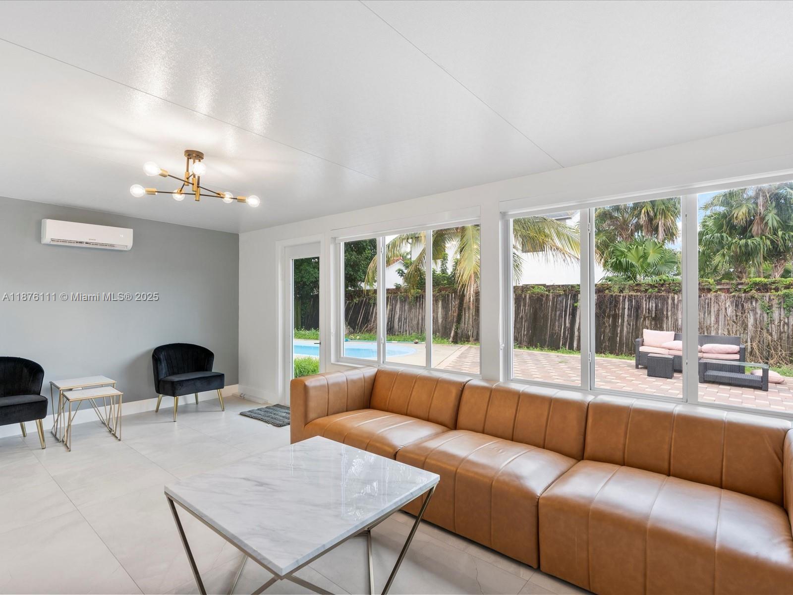 5731 Southwest 54th Terrace Davie, FL 33314 - Photo 2 of 22 a living room with furniture and a large window
