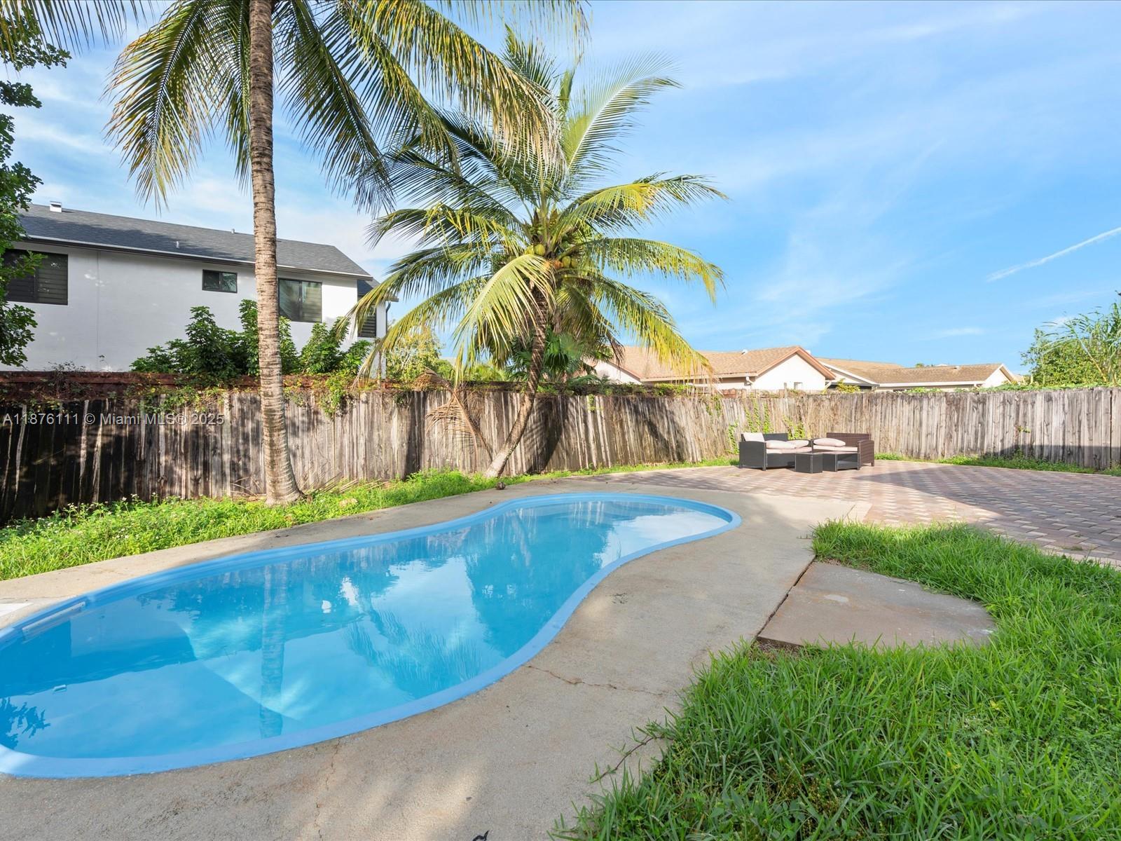 5731 Southwest 54th Terrace Davie, FL 33314 - Photo 21 of 22 a view of a backyard with a patio