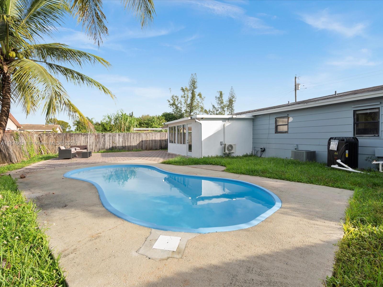 5731 Southwest 54th Terrace Davie, FL 33314 - Photo 22 of 22 a view of a house with swimming pool