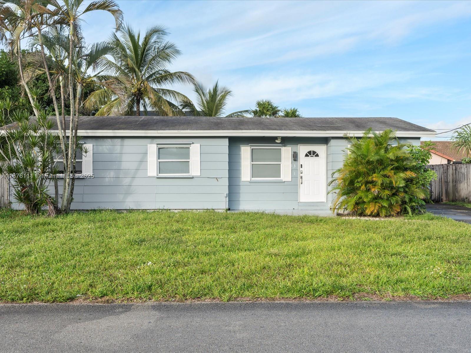5731 Southwest 54th Terrace Davie, FL 33314 - Photo 3 of 22 front view of house with a yard