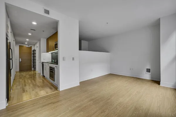 a view of a big room with wooden floor