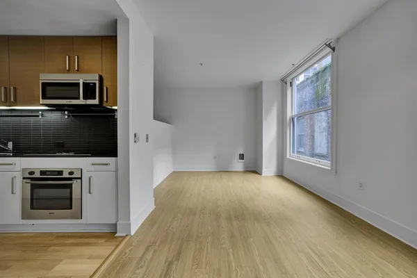 a view of a room that has a window in it
