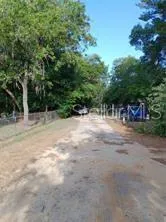 a view of a house with a tree