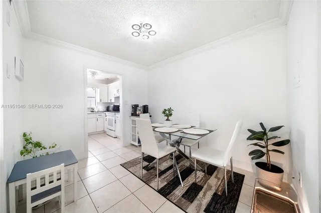 a kitchen with cabinets appliances a sink and a counter top space