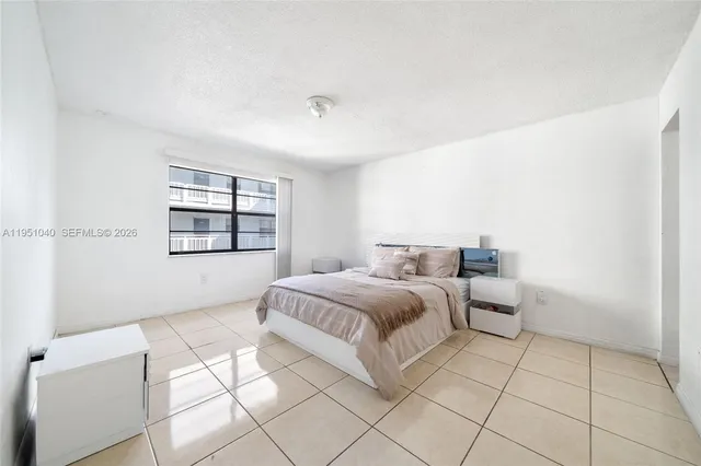 a bathroom with a sink and mirror with toilet