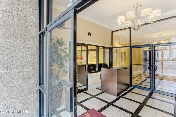 a view of a balcony with furniture