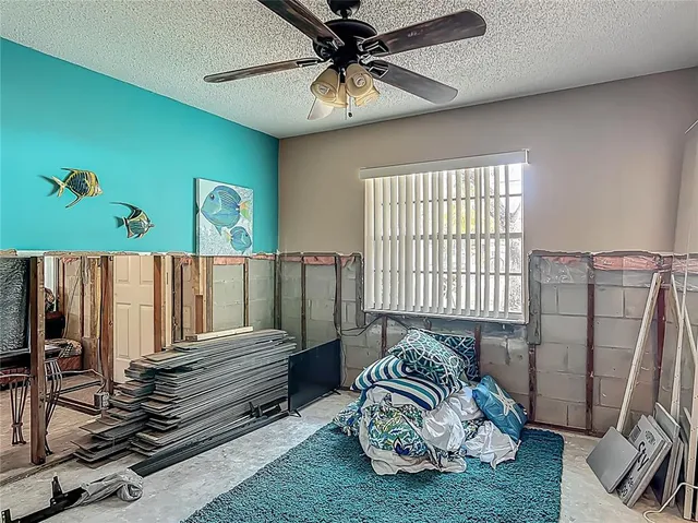 a bedroom with furniture and a window