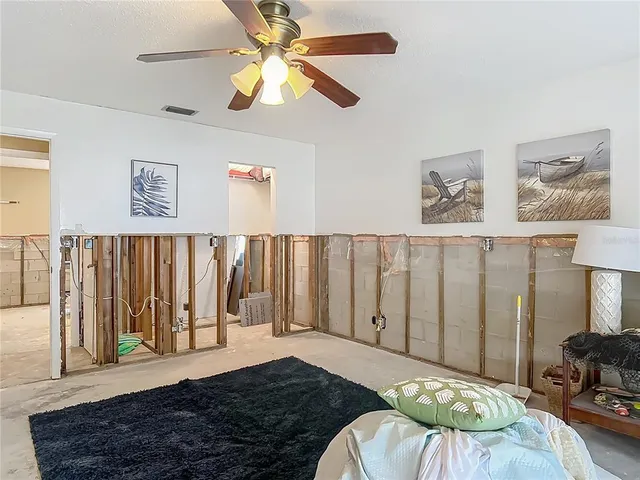 a bedroom with furniture and a chandelier