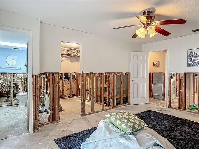 a bathroom with a toilet and a shower curtain