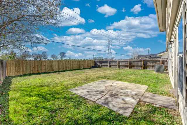 a view of a backyard with grass