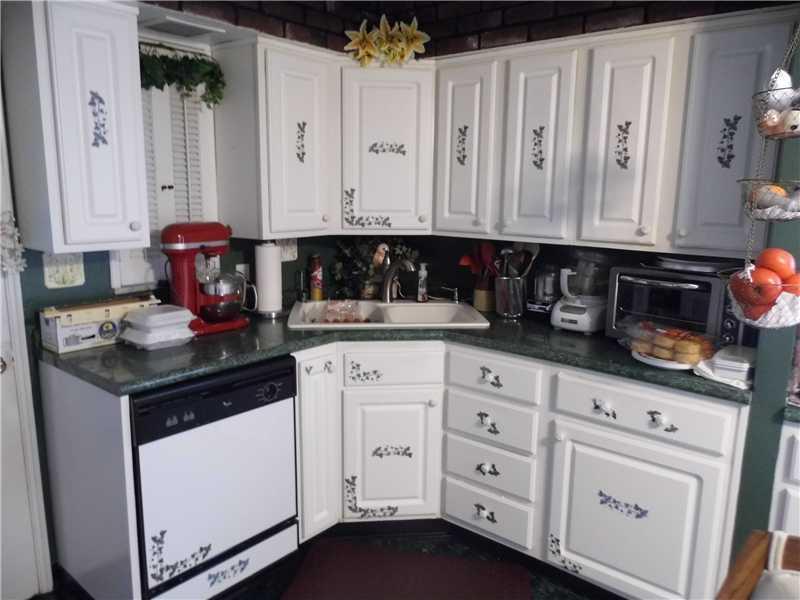 Kitchen. CABINETS/STORAGE ABOUND IN PICURESQUE KITCHEN
