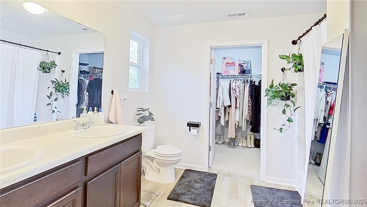 29 York Court Spring Lake, NC 28390 - Photo 16 of 22 a bathroom with a sink vanity granite and a shower