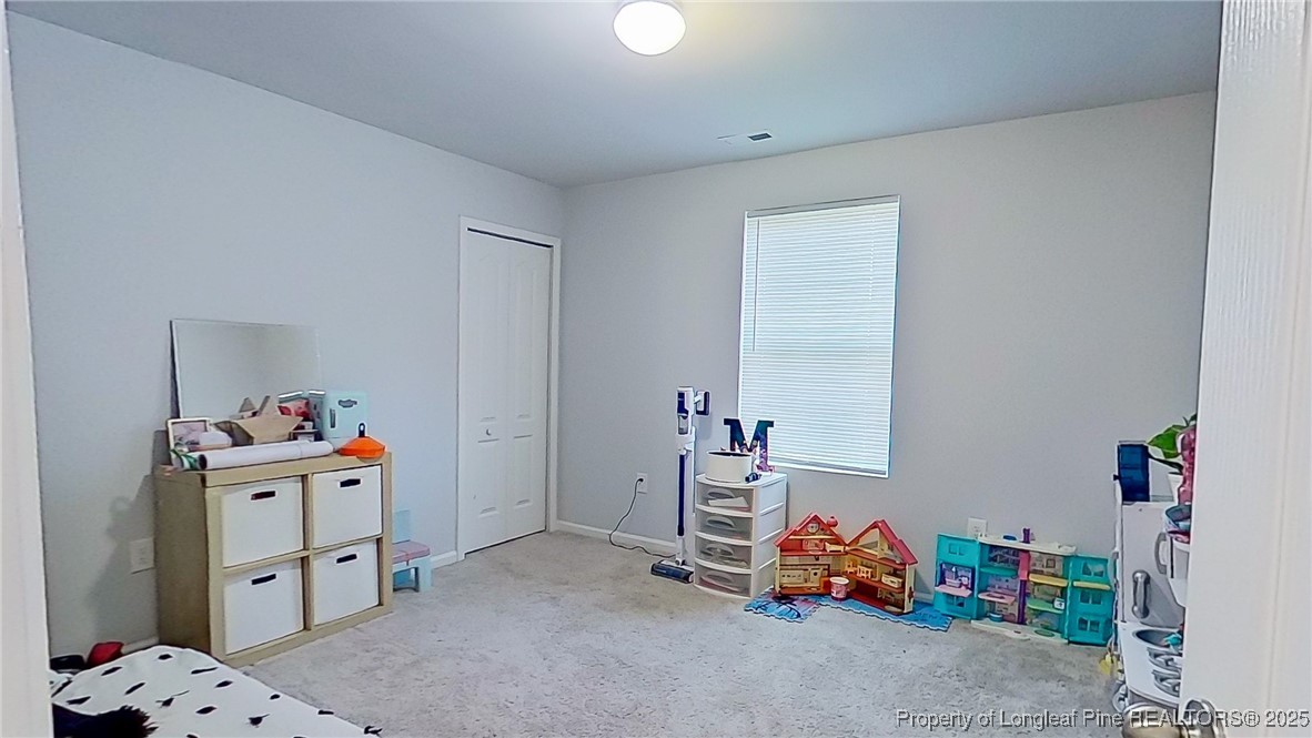 29 York Court Spring Lake, NC 28390 - Photo 18 of 22 a room with toys and a baby crib
