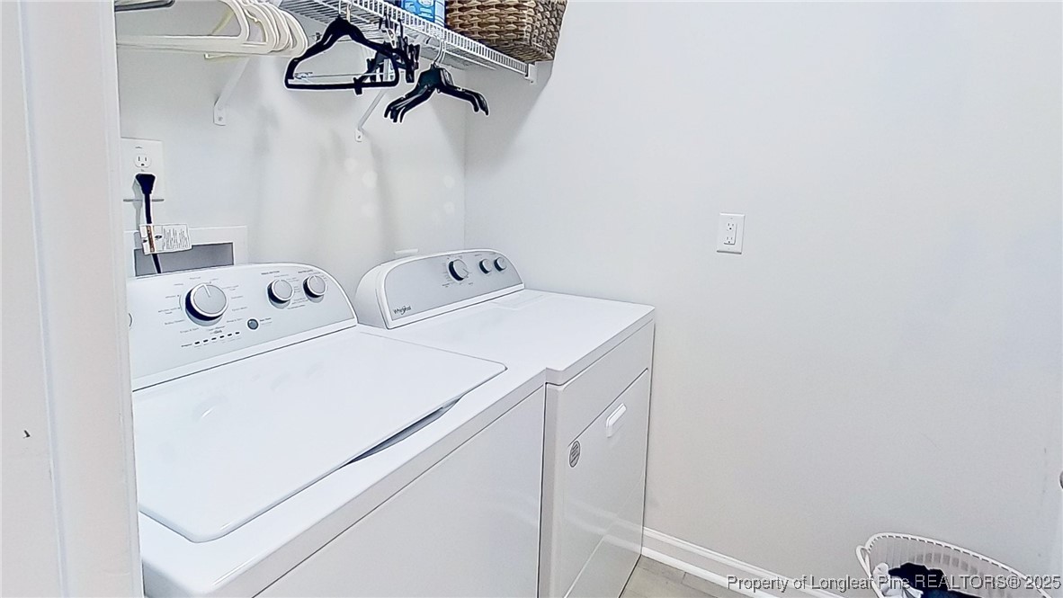 29 York Court Spring Lake, NC 28390 - Photo 21 of 22 a utility room with dryer and washer