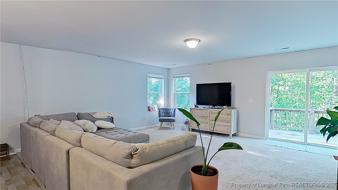 29 York Court Spring Lake, NC 28390 - Photo 5 of 22 a living room with furniture and a flat screen tv