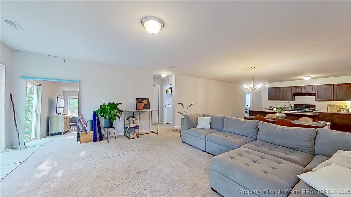 29 York Court Spring Lake, NC 28390 - Photo 6 of 22 a living room with furniture and potted plants