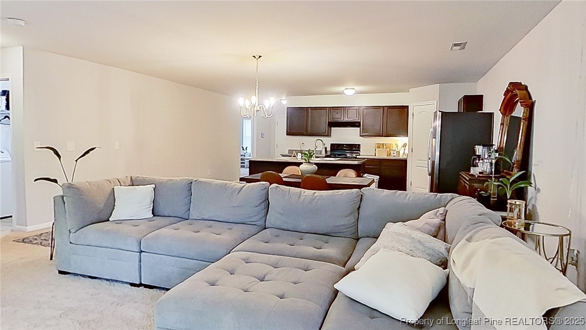 29 York Court Spring Lake, NC 28390 - Photo 8 of 22 a living room with furniture kitchen view and a window