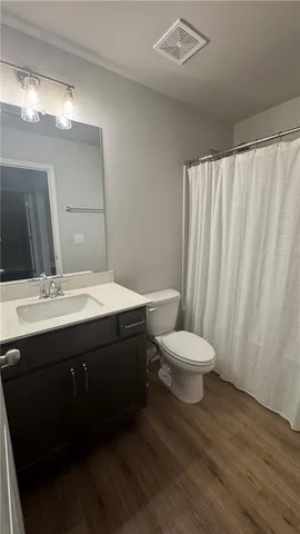 a bathroom with a sink and a toilet