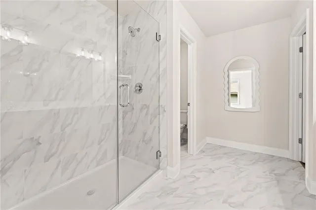 a bathroom with a bathtub and shower