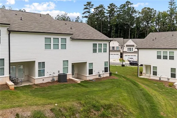 a aerial view of a house with a yard