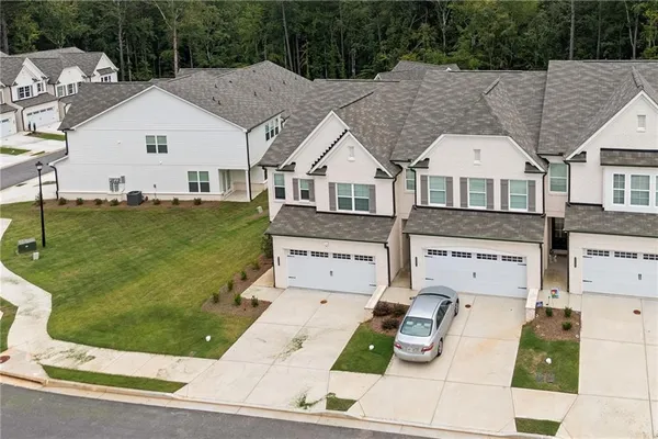 an aerial view of a house with a swimming pool