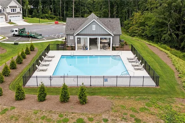 an aerial view of a house with a swimming pool