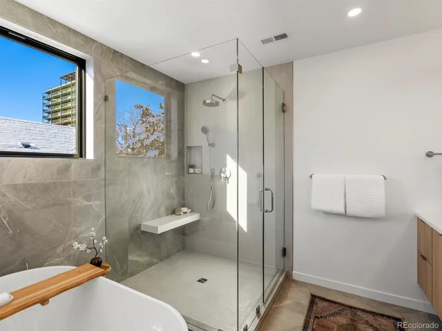 a bathroom with a toilet sink and shower