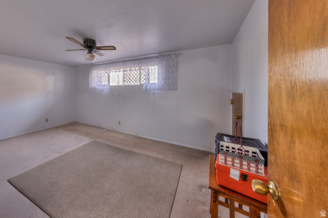 738 Locust Lane Moab, UT 84532 - Photo 14 of 25 Empty room with carpet and a ceiling fan