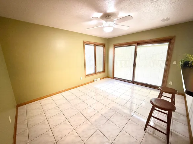 a view of an empty room and window