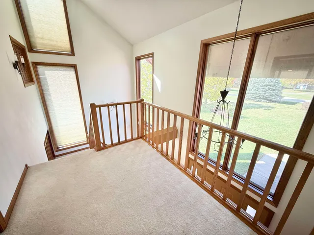 a view of staircase with rug floor