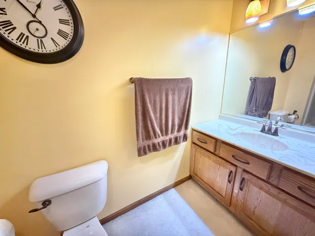 a bathroom with a sink a mirror and a toilet