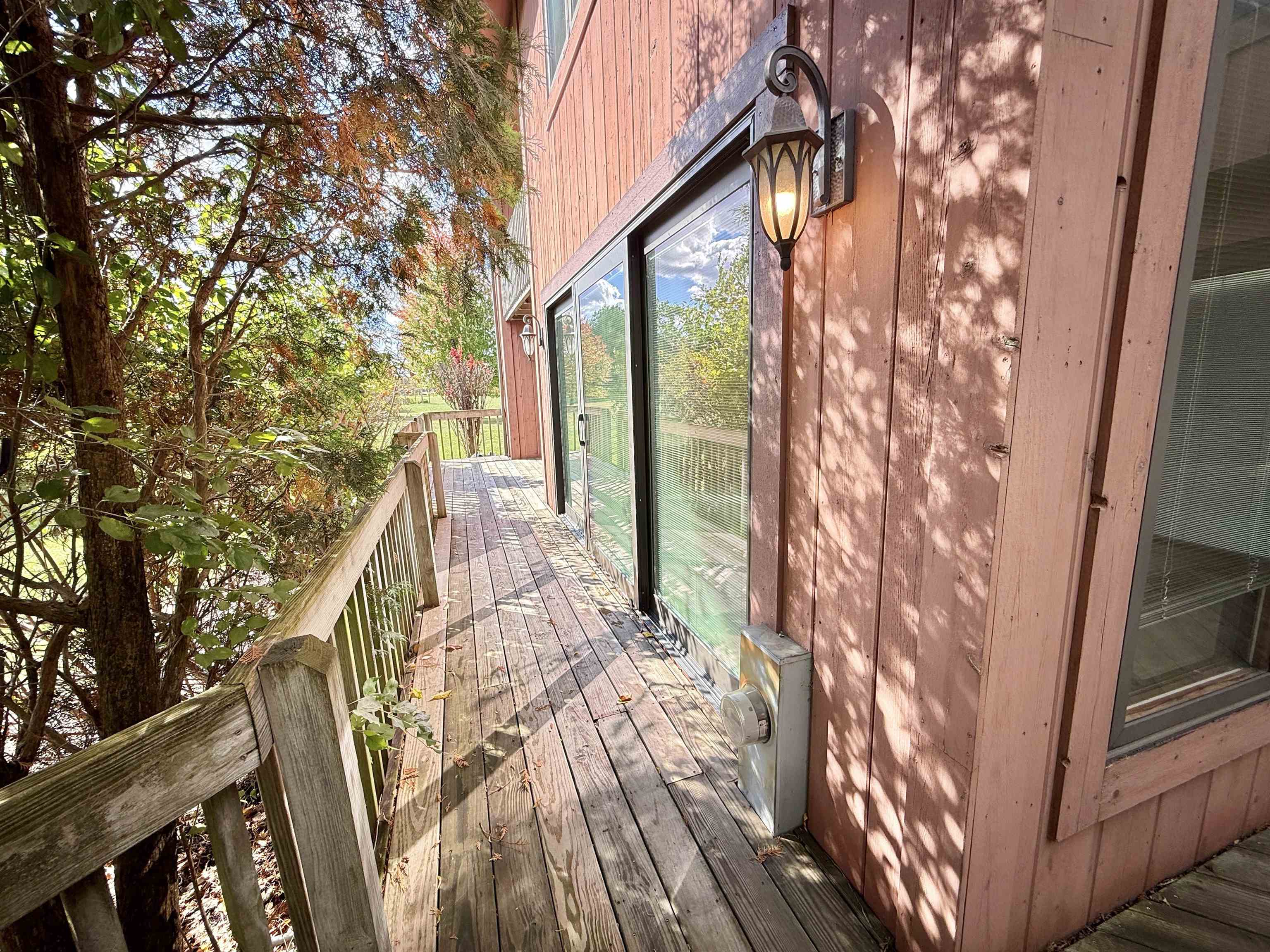 5449 South Branch Court Rochelle, IL 61068 - Photo 42 of 45 a view of balcony with wooden floor and fence