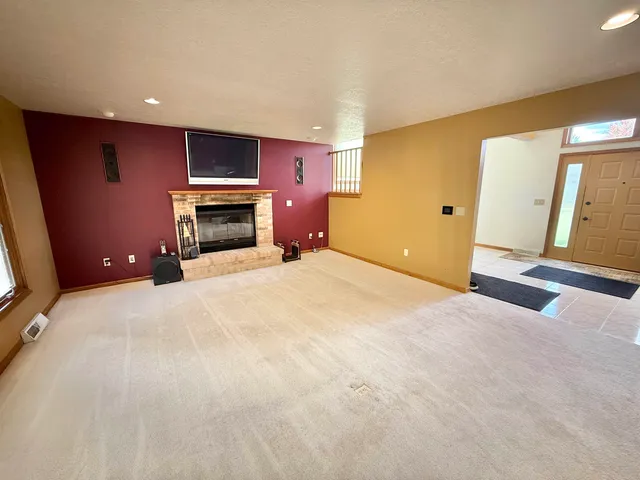 a view of a livingroom with a fireplace