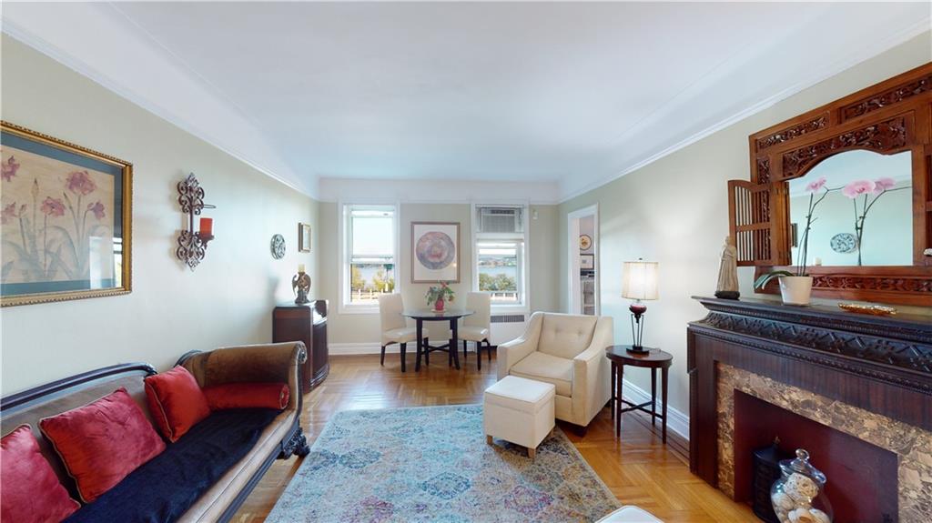 9701 Shore Road, Unit 1N Brooklyn, NY 11209 - Photo 2 of 18 a living room with furniture or couch and a fireplace