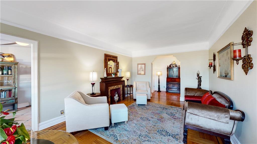 9701 Shore Road, Unit 1N Brooklyn, NY 11209 - Photo 3 of 18 a living room with furniture and a flat screen tv