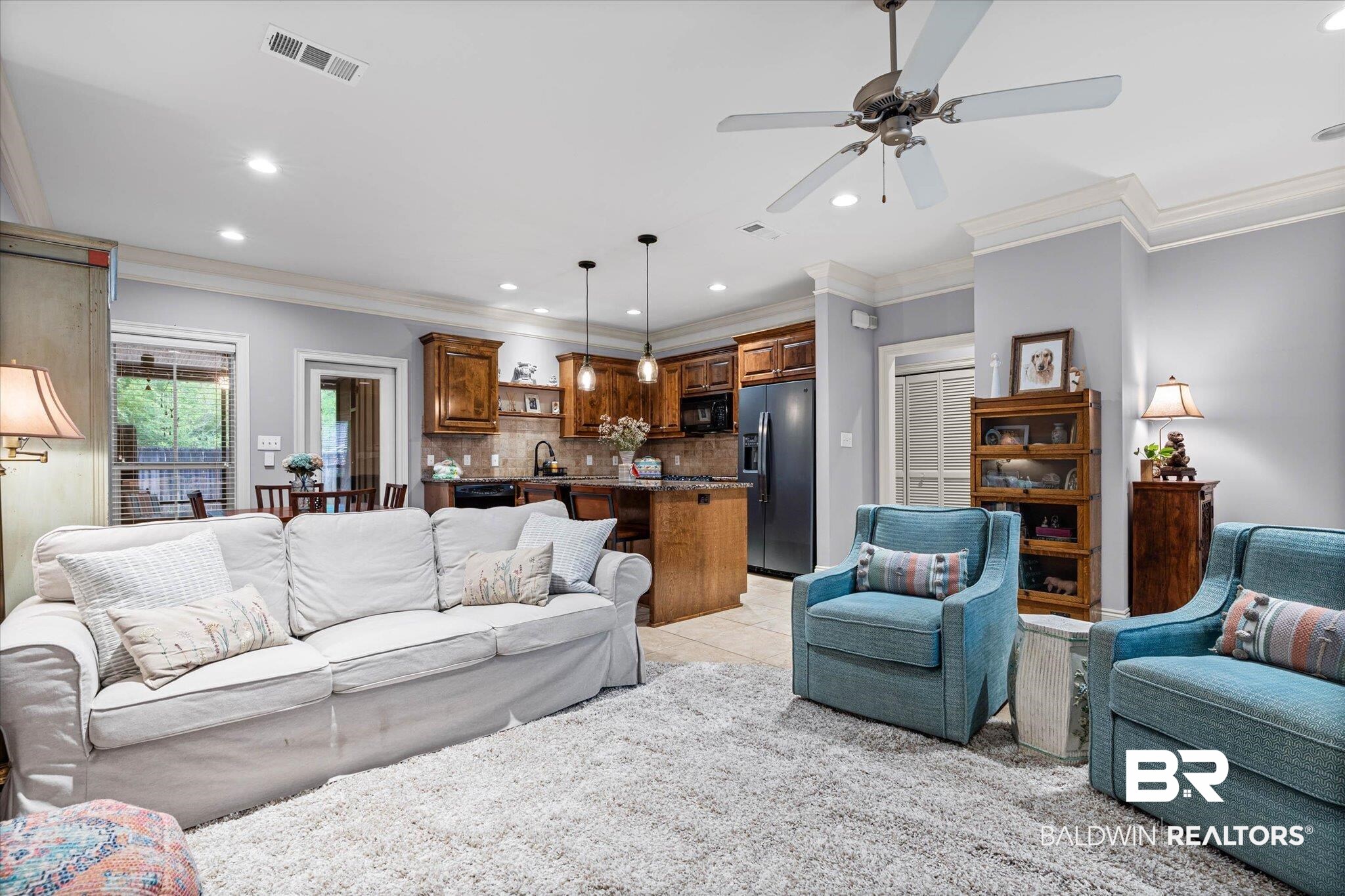 9916 Windmill Road, Unit 14 Fairhope, AL 36532 - Photo 3 of 12 Living room with recessed lighting, crown molding, ceiling fan, and light tile patterned flooring