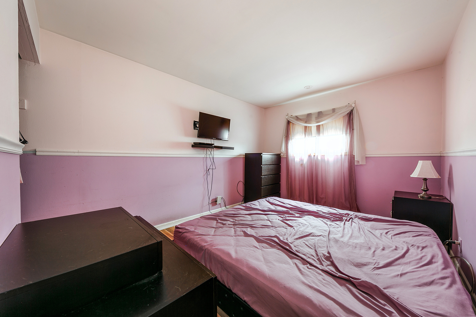 192 South Pinecrest Road Bolingbrook, IL 60440 - Photo 13 of 21 a bedroom with a bed and a flat screen tv